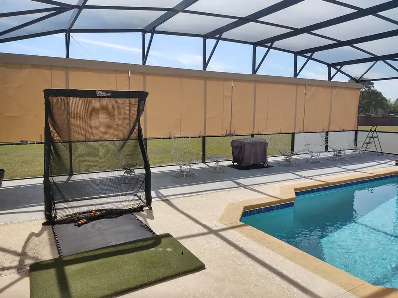 Tan Sunbrella privacy curtains installed in Punta Gorda FL pool cage