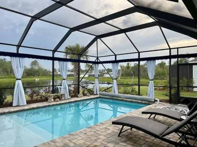 Sunbrella outdoor curtains with waterfront view in Punta Gorda FL lanai