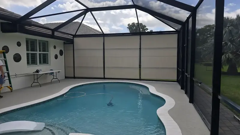 Manual roll-down shade with UV protection fabric for Sarasota patio enclosure